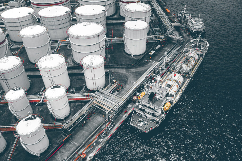 Energy storage tanks and logistics vessel at terminal – sustainable energy trading and certified operations